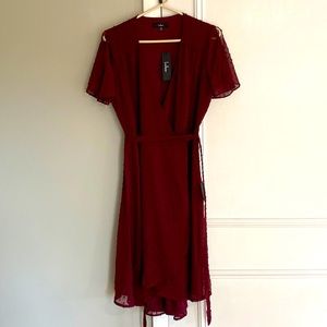 Classically Charming Burgundy Swiss Dot Wrap Midi Dress
Lulus
